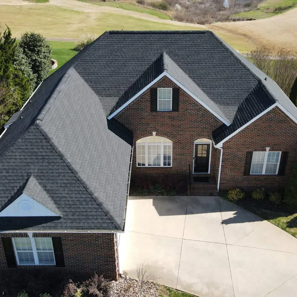 Statesville roof replacement project showing a gray shingle roof on a single-story home.